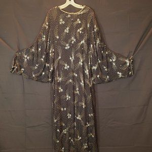 Long sleeved formal full length black beaded gown with sequins